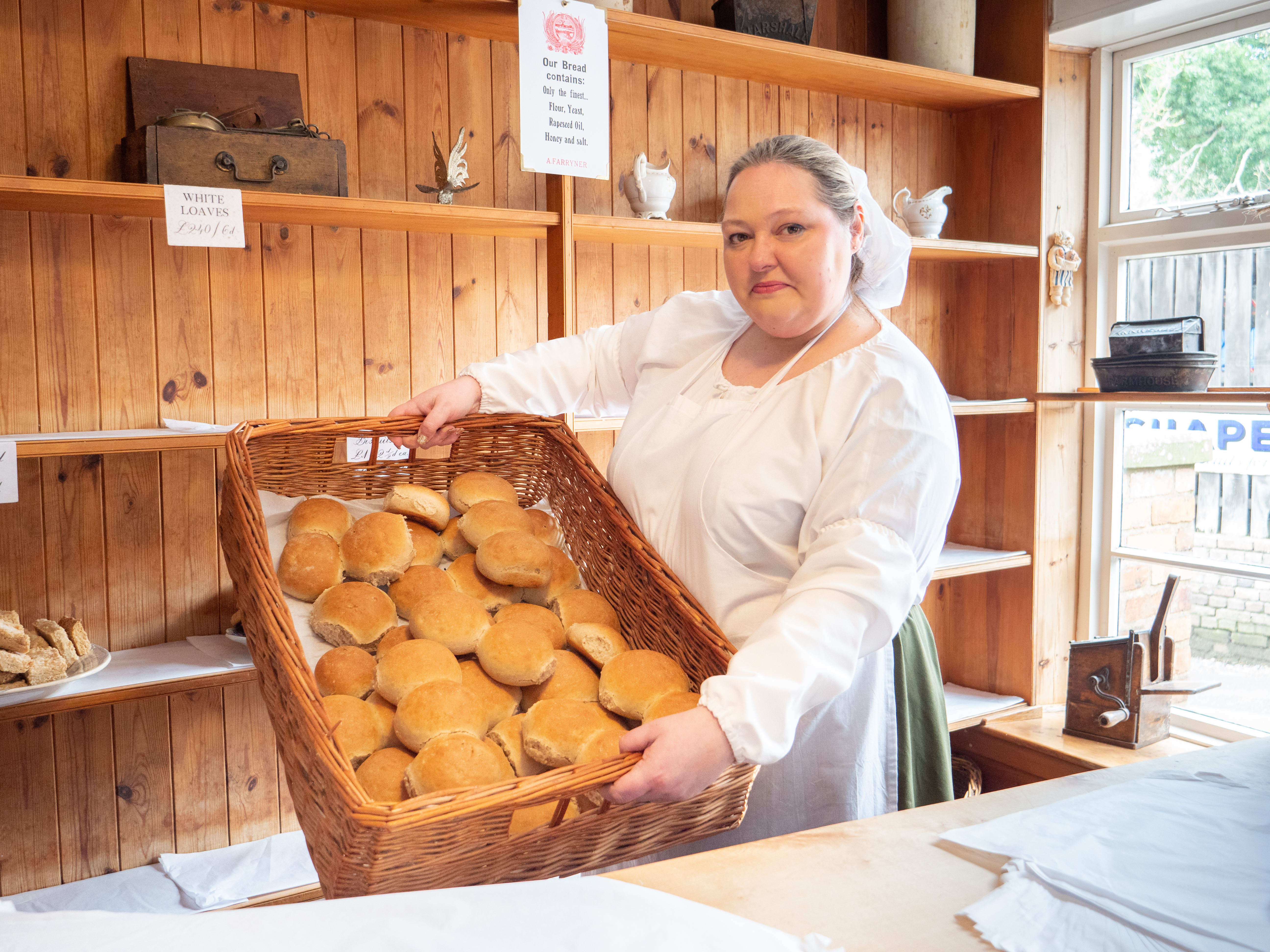 Getting Bread Out Of The Oven At Blists Hill Victorian Town's Bakery A Farryner Using New Oven Cuffs Manufactured By Bronwyn In Wardrobe Modelled By Faye March 2023 (1 Of 8)