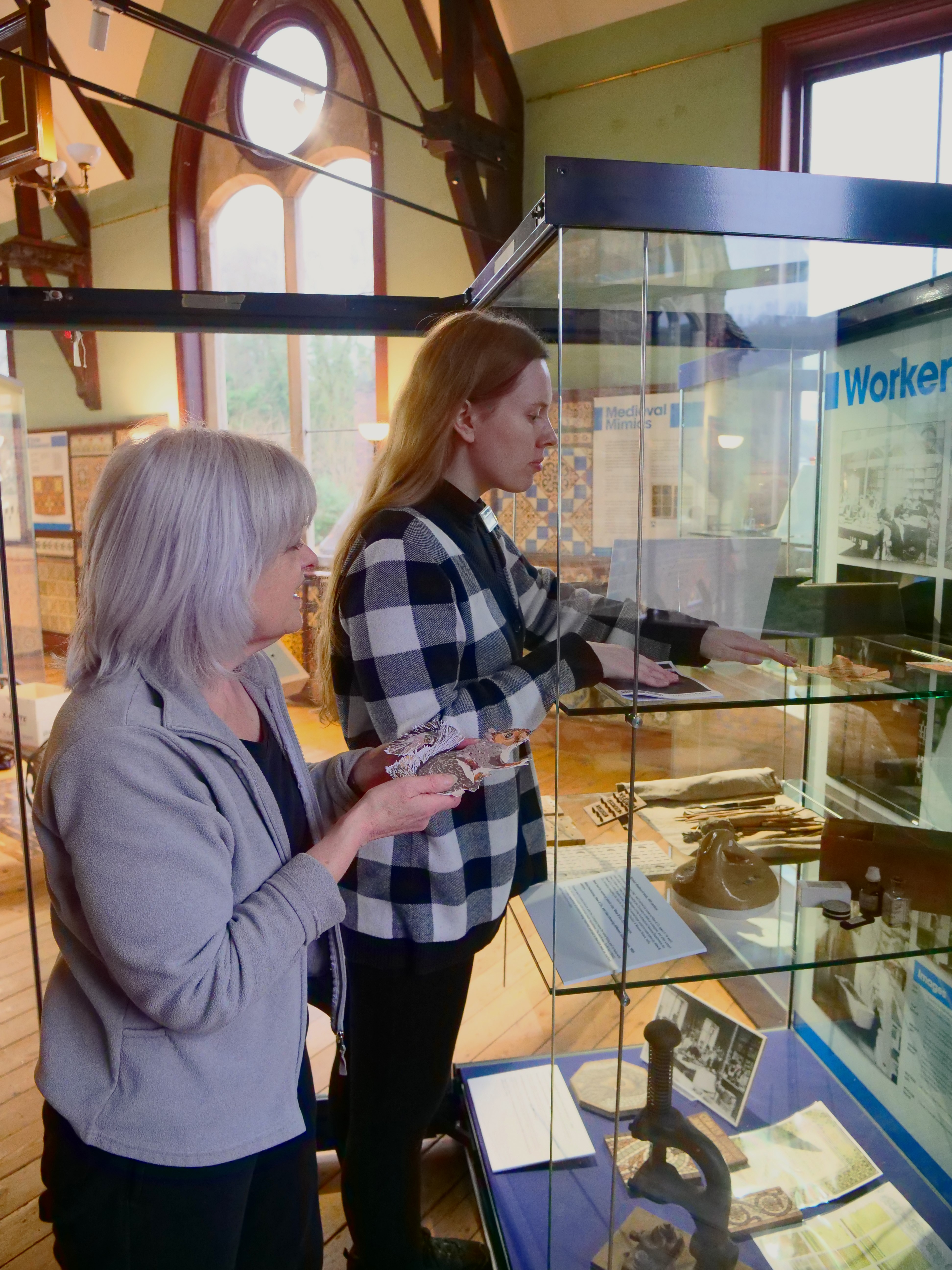 Kate Cadman and Kyla Hislop installing Shrewsbury College takeover at Jackfield Tile Museum